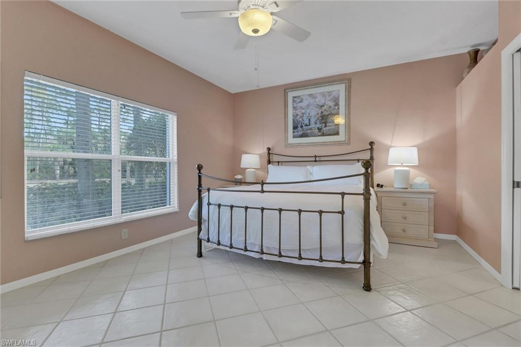 Tiled bedroom with ceiling fan