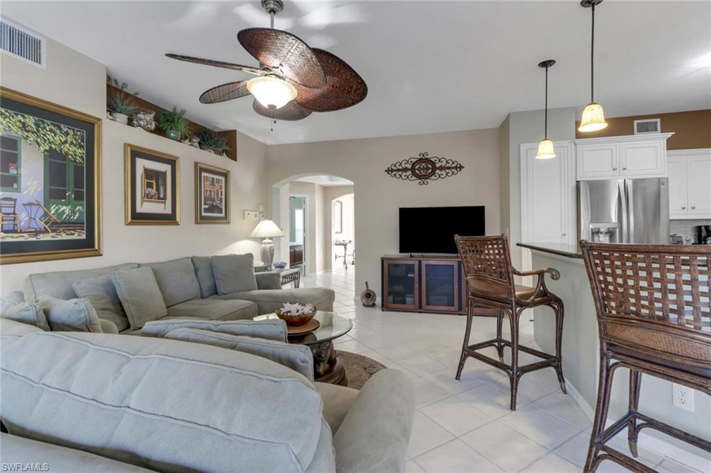 Tiled living room with ceiling fan