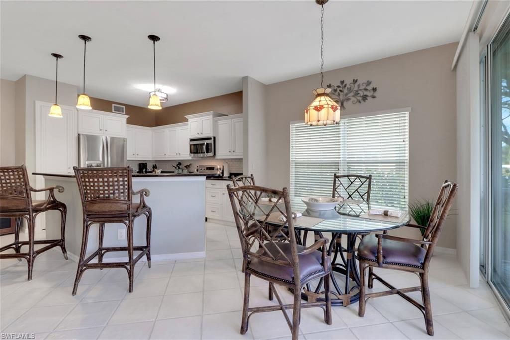 Dining area featuring light tile patterned flooring