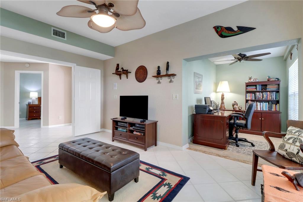 Living room with light tile patterned floors