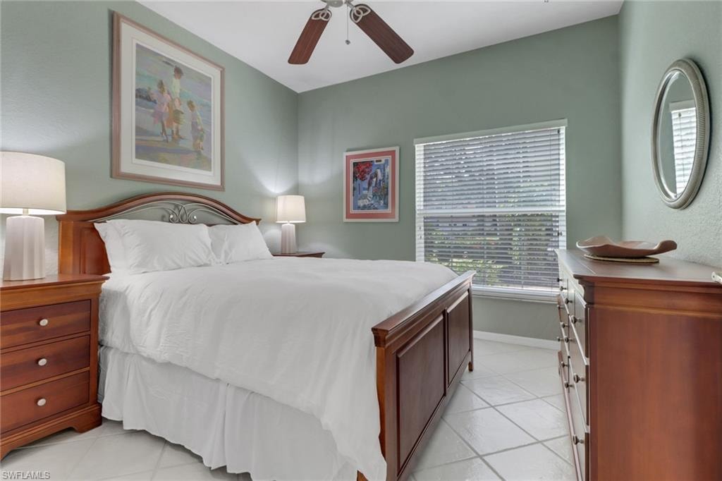 Tiled bedroom with ceiling fan