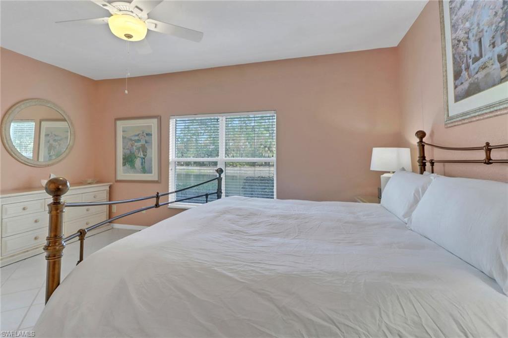 Tiled bedroom with ceiling fan
