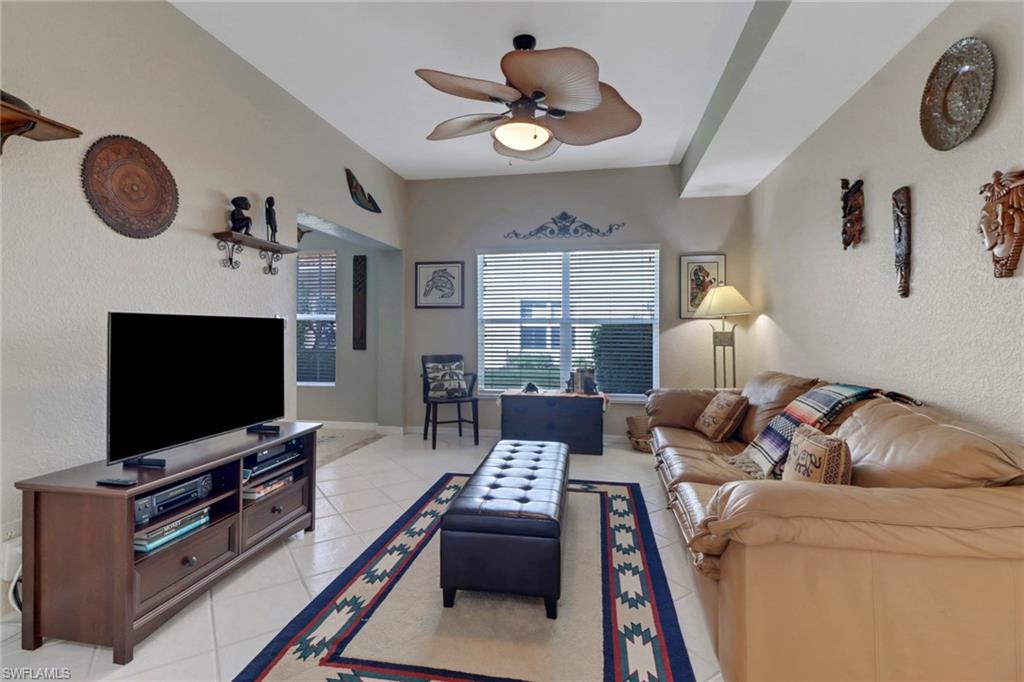 Tiled living room with ceiling fan