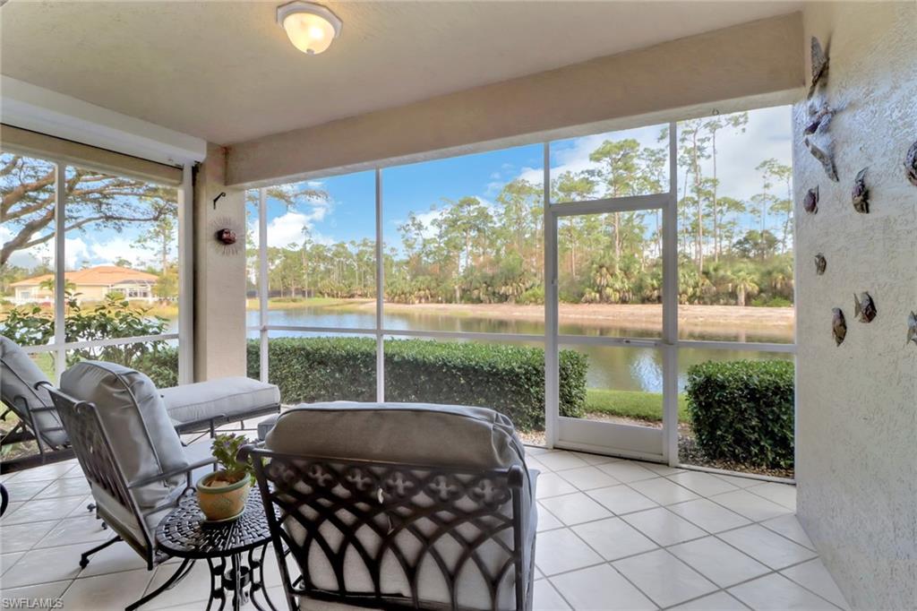 Sunroom with a water view