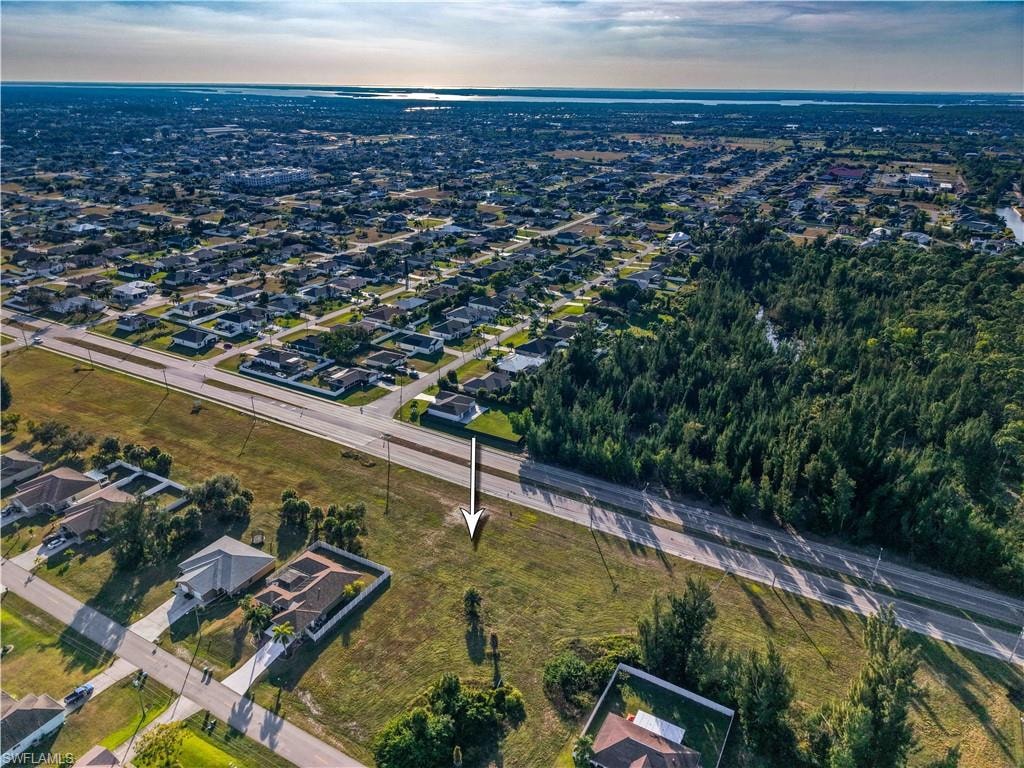 Aerial overview of property's location featuring nearby suburban area