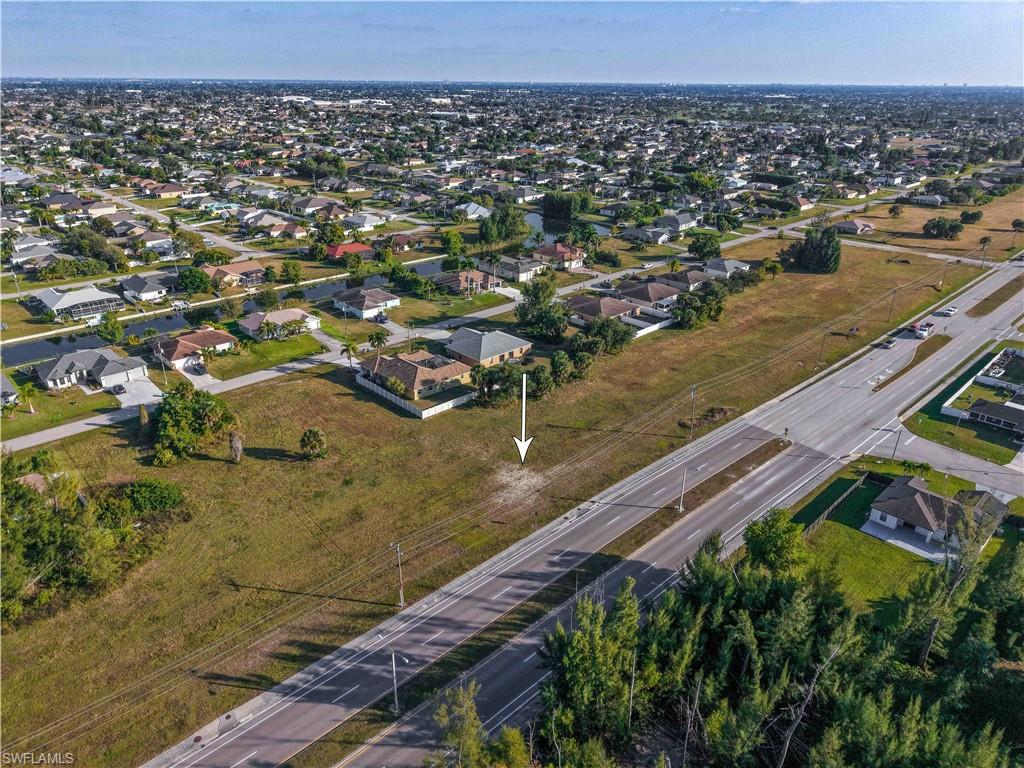 Aerial overview of property's location featuring nearby suburban area