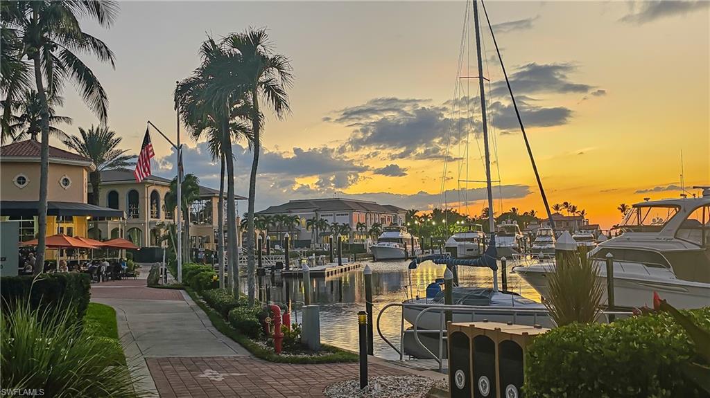 View of community with a water view and a dock