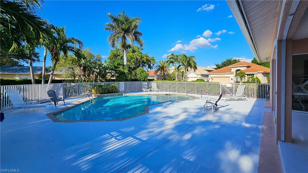 Community pool featuring a patio