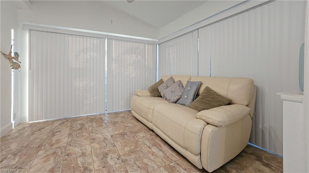 Living area featuring lofted ceiling