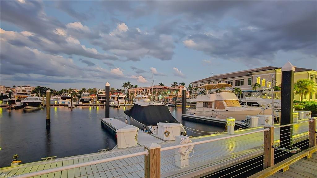 Dock with a water view and a residential view