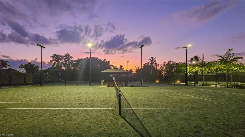 View of tennis court featuring a gazebo