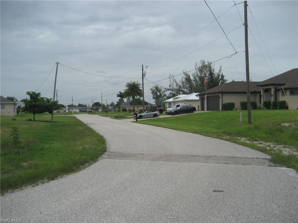 View of asphalt street with a residential view