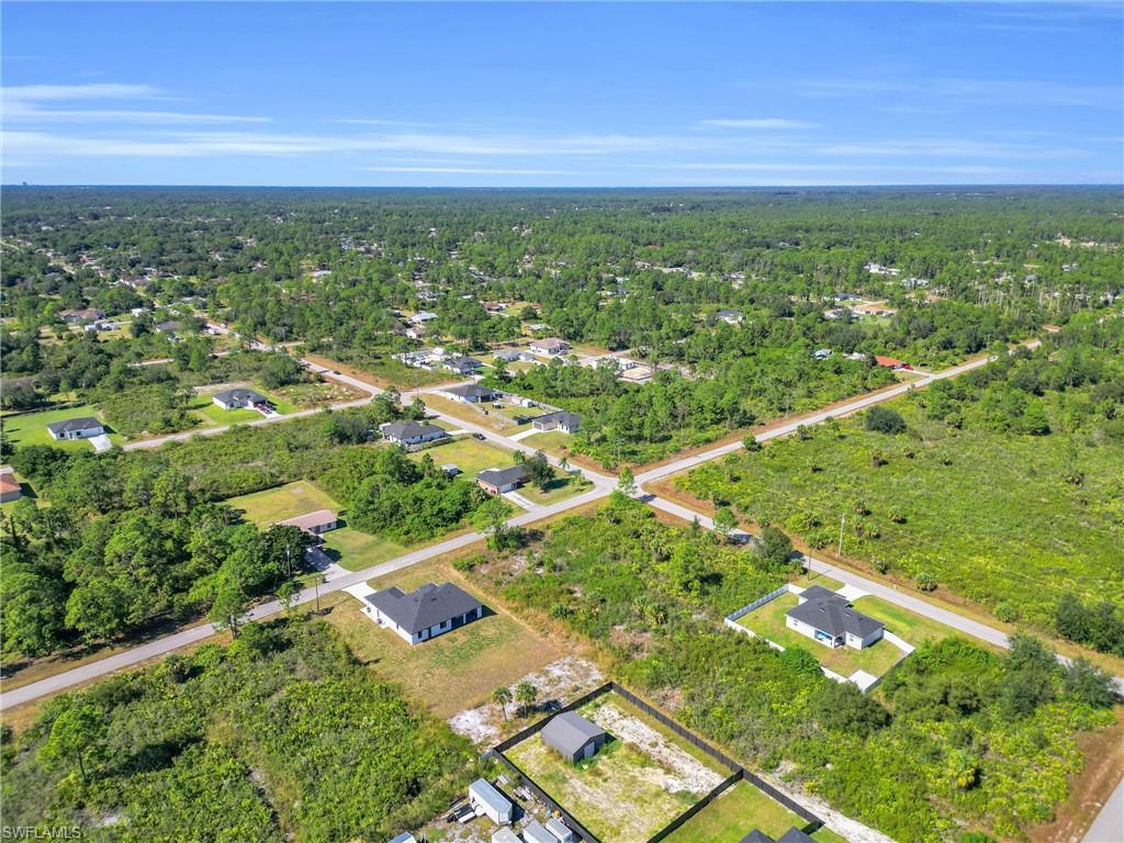 Aerial view of property's location featuring nearby suburban area