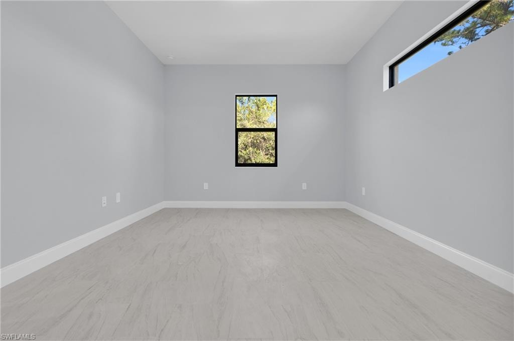 Spare room featuring plenty of natural light