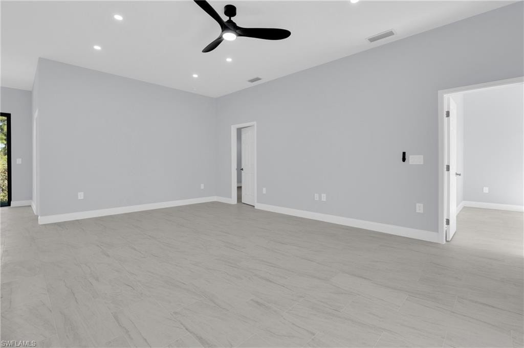 Spare room with recessed lighting and a ceiling fan