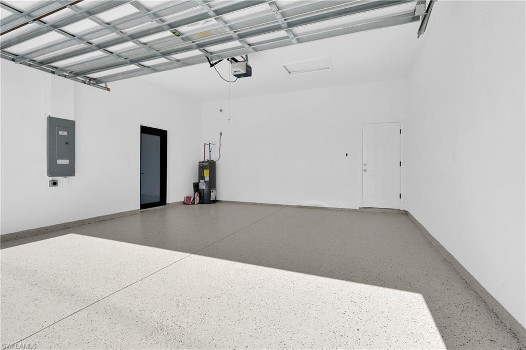 Garage with electric panel and water heater