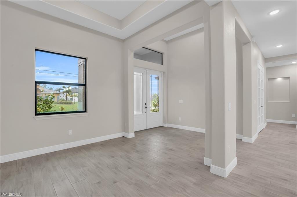 Foyer entrance featuring light wood-style floors and recessed lighting