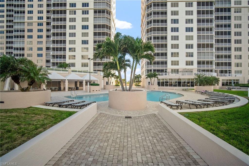 Community pool with a lawn and a patio