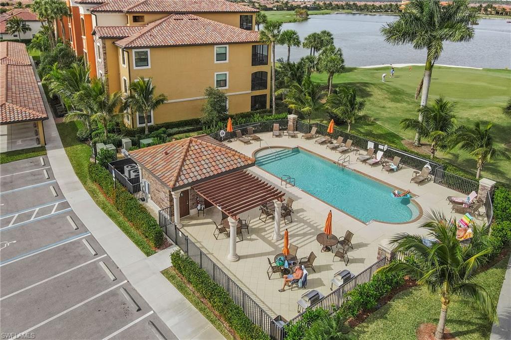 Convenient satellite pool along side the building with grill area.