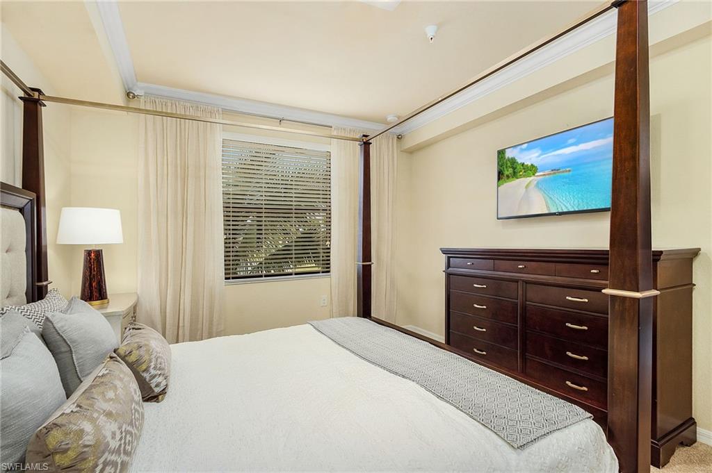 Another view of master bedrm with private TV. and two Walk-in closets