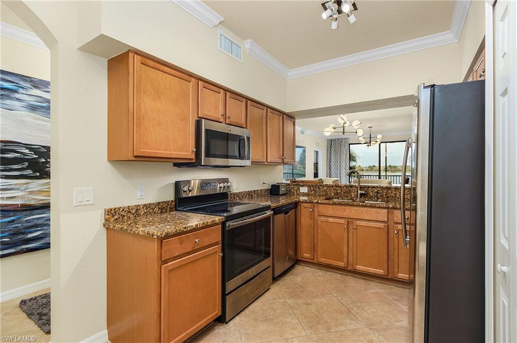 Pantry closet and stainless steel appliances.