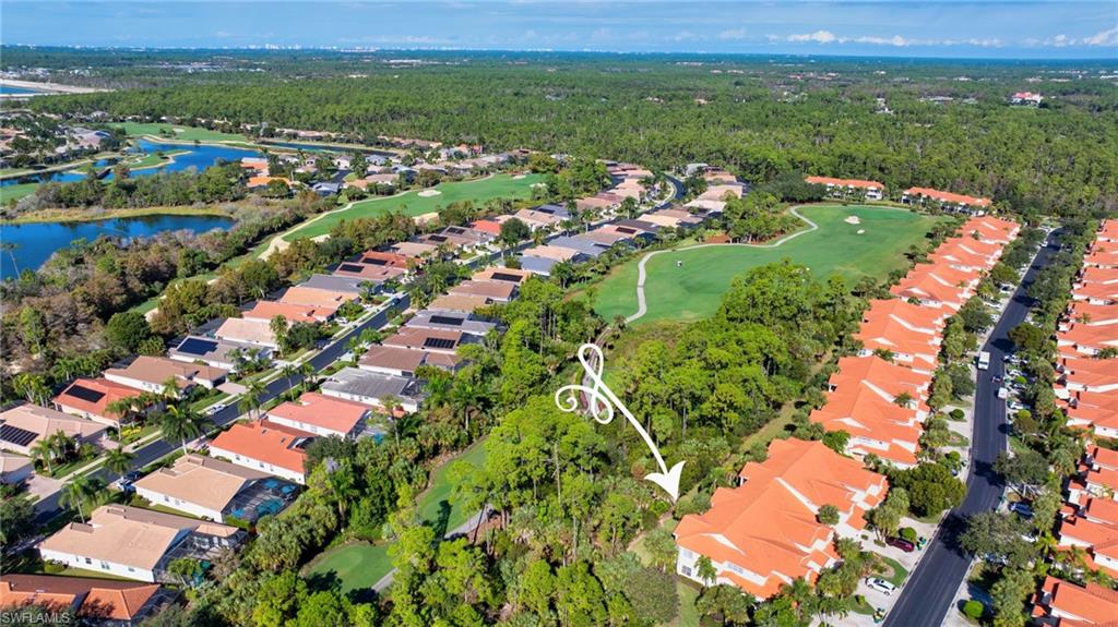 View of property location featuring nearby suburban area and a golf course