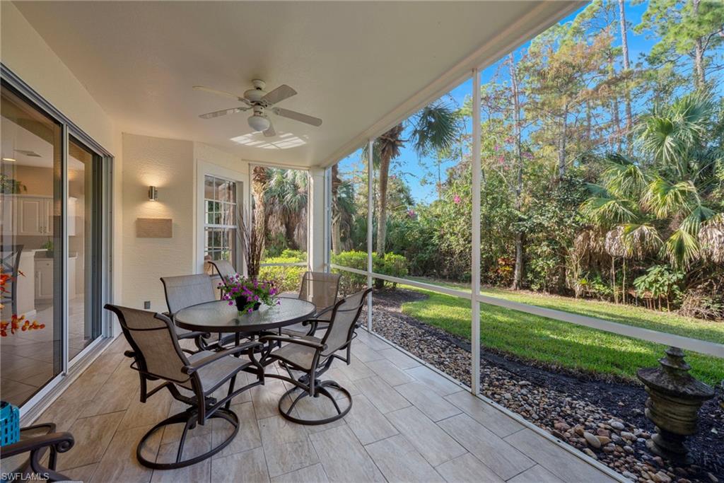 Sunroom / solarium featuring ceiling fan and outdoor dining space