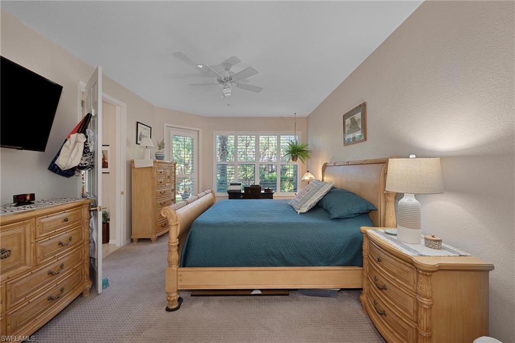 Bedroom featuring ceiling fan and light colored carpet