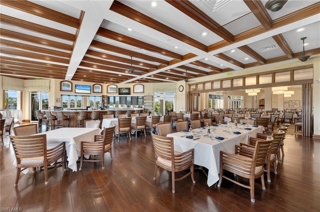 Dining room featuring coffered ceiling, beamed ceiling, dark wood-style flooring, and recessed lighting