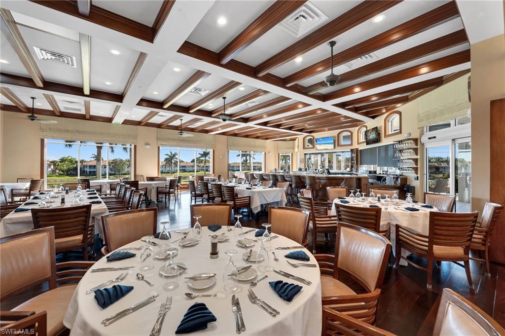 Dining room featuring ceiling fan, beamed ceiling, coffered ceiling, plenty of natural light, and recessed lighting