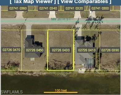 Aerial overview of property's location featuring property parcel outlined