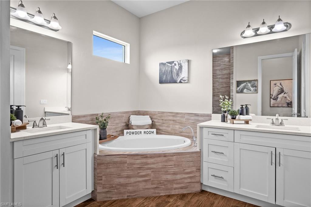 soaking tub, double vanities, and cave link custom walk in shower