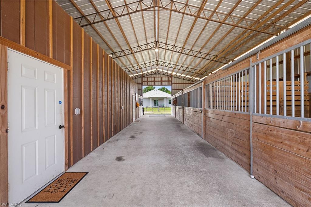 horse stalls, guest apartment, and storage, concrete aisle