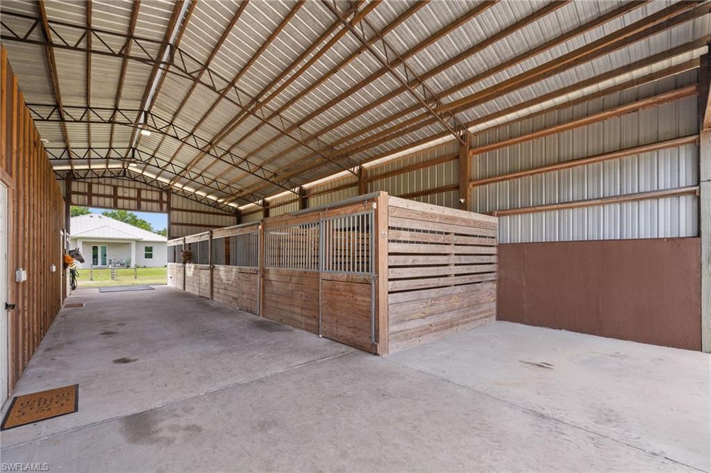 horse stalls and storage, concrete aisle