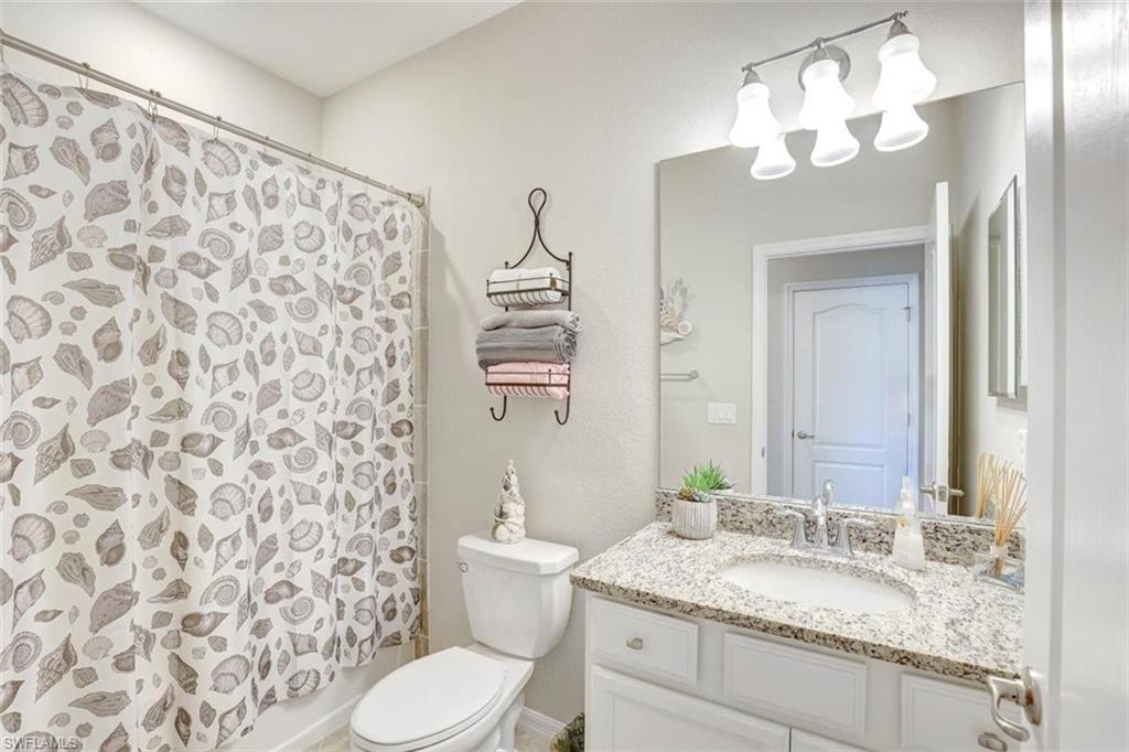 Bathroom with vanity and shower / tub combo