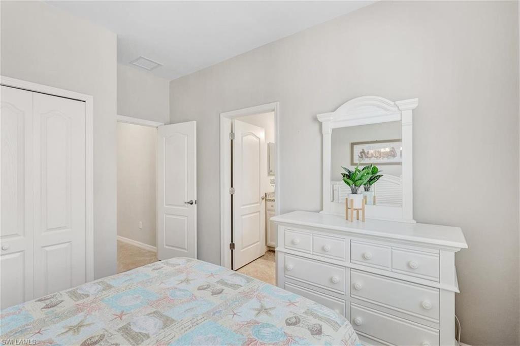 Bedroom featuring a closet and connected bathroom