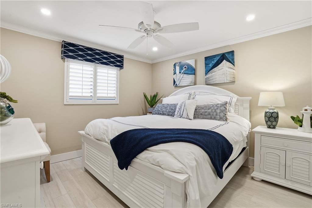 Guest bedroom with coastal decor -virtually enhanced