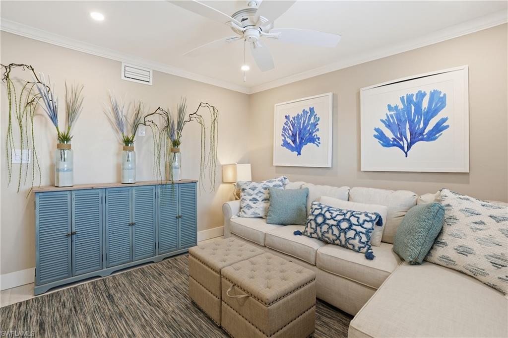 Den area with beautiful coastal decor - virtually enhanced