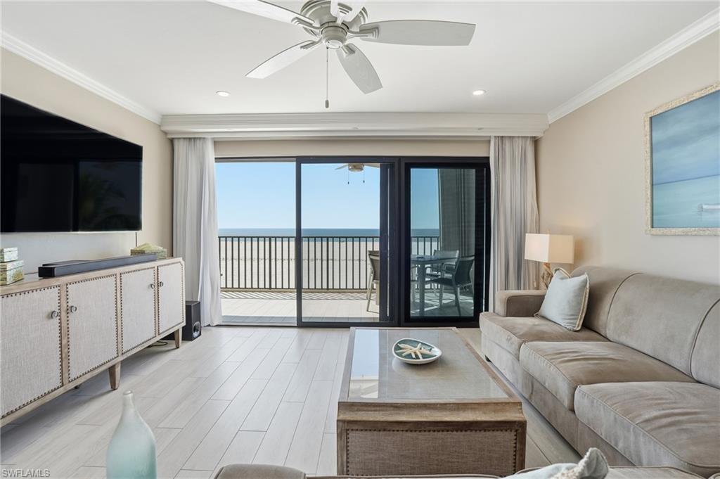 Living room area with Gulf views - virtually enhnaced