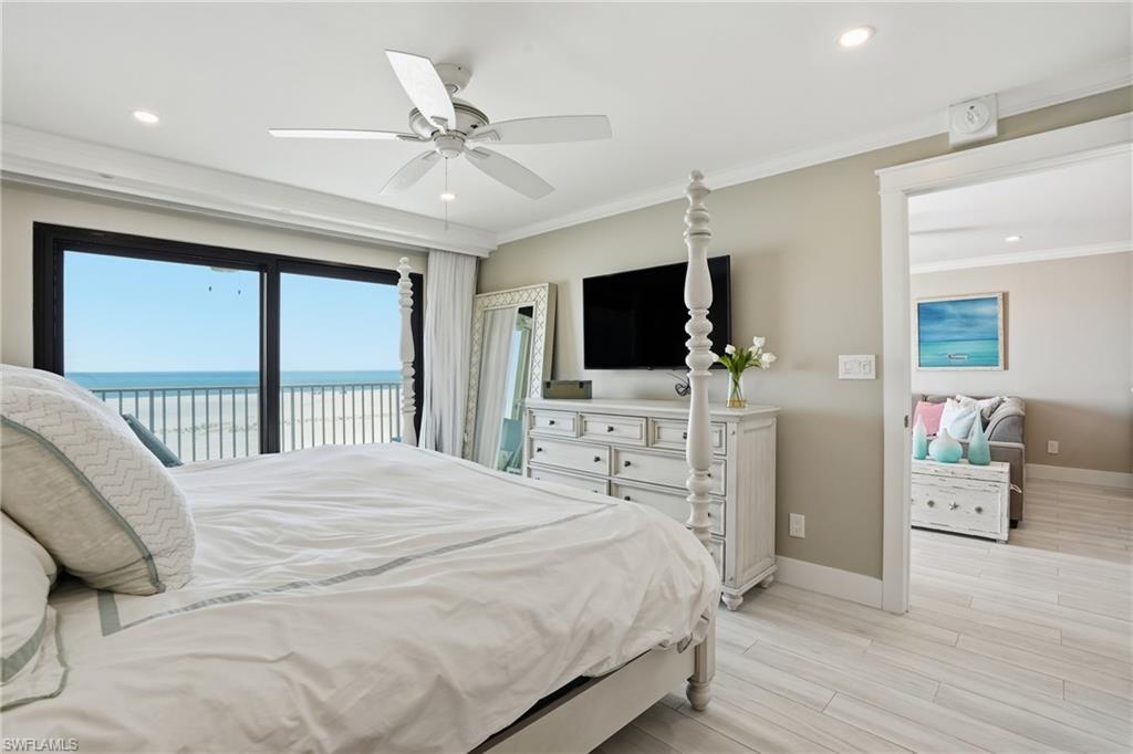 Primary bedroom with Gulf views & balcony -virtually enhanced