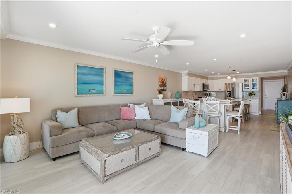 Open floor plan with living room flowing into kitchen area - virtually enhanced