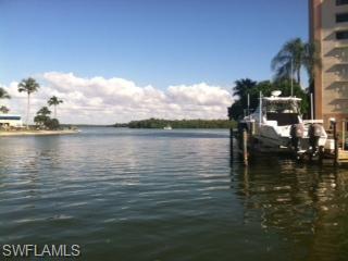 Dock area with a water view and boat lift that are available to purchase.