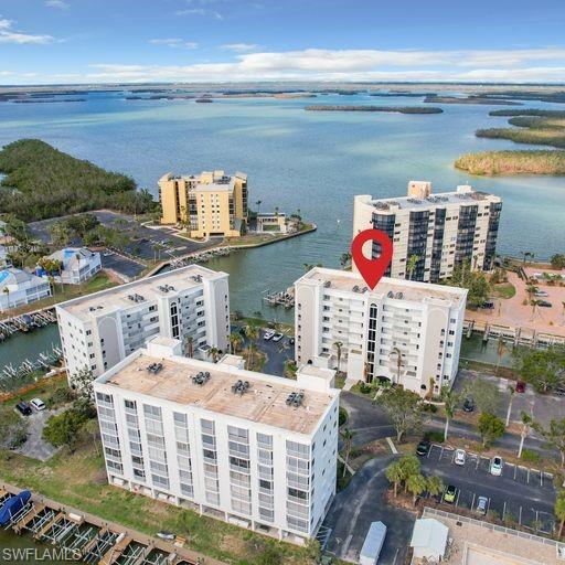 Bird's eye view of a large body of water and apartment complex / building