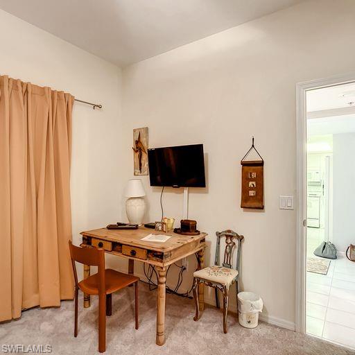 Home office with tile patterned flooring
