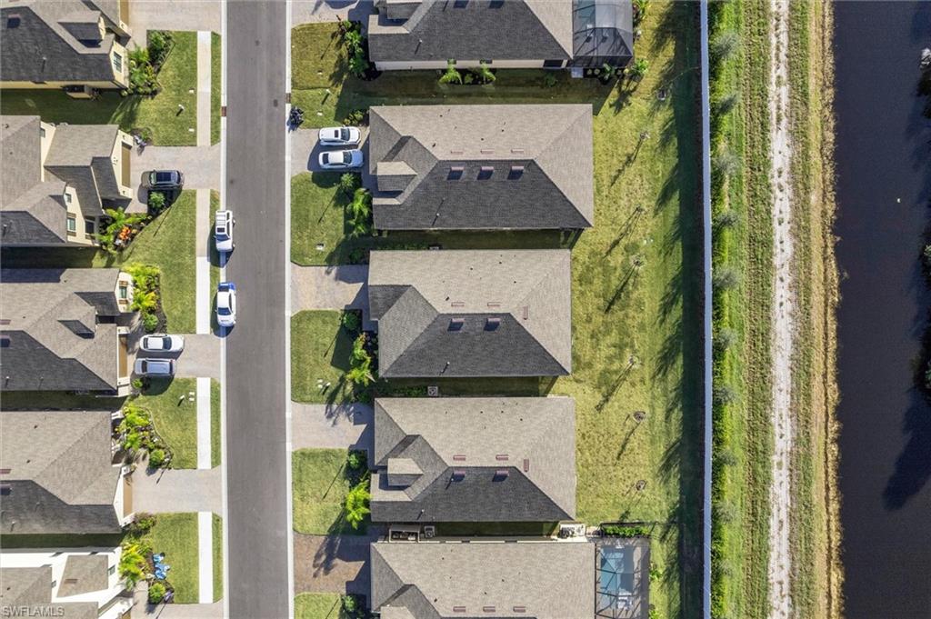 Aerial overview of property's location with nearby suburban area