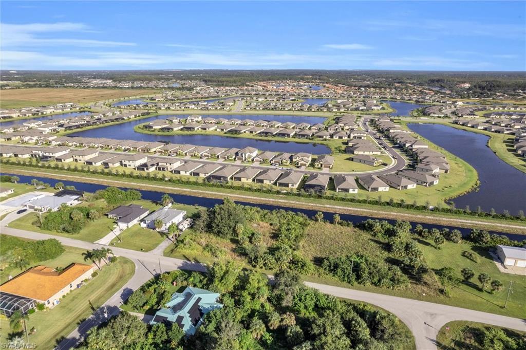 View of property location with nearby suburban area and a large body of water
