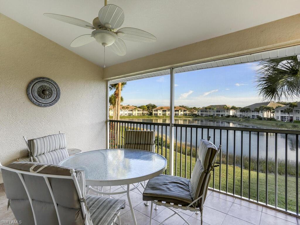 Sunroom with a water view