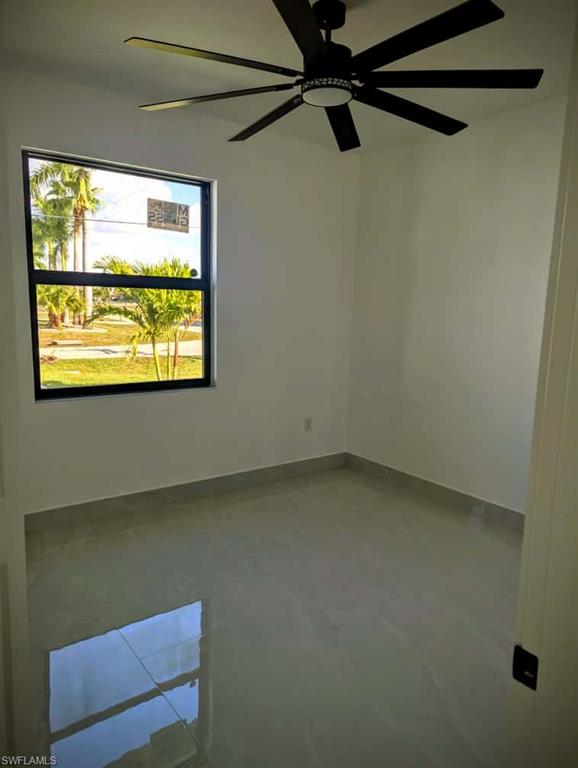 Unfurnished room with ceiling fan