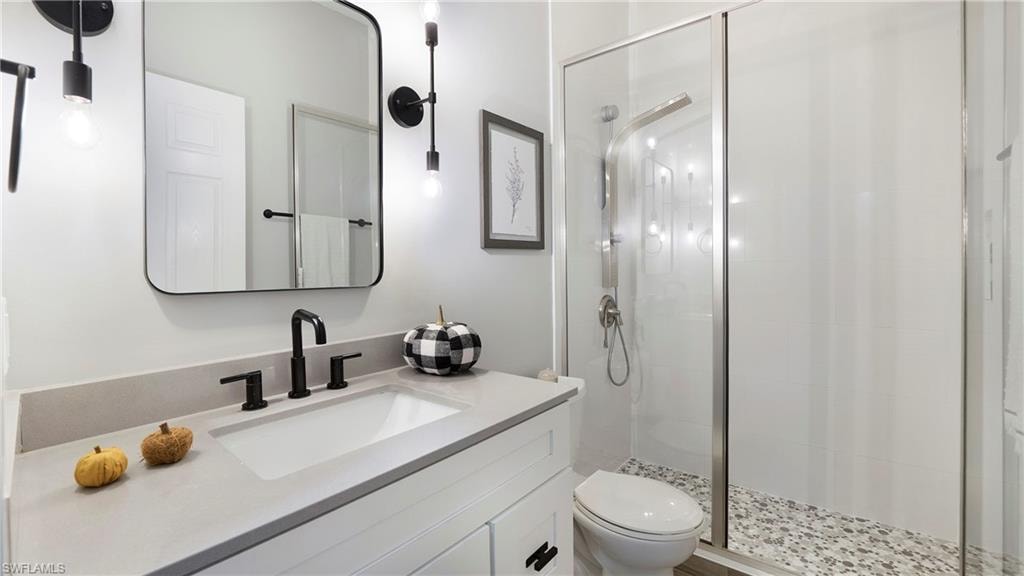 Bathroom with vanity and a stall shower