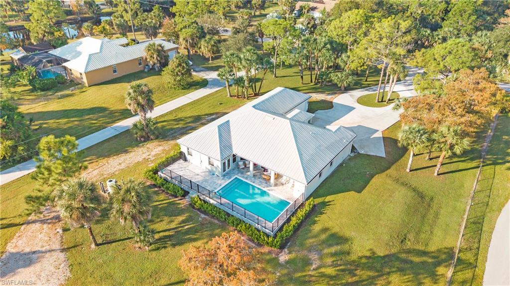 View of subject property featuring a pool